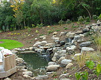 The conclusion of this project results in a waterfall that appears to emerge out of the side of a hillside.