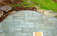 Detail of how the stone slab step was cut into the bluestone patio.