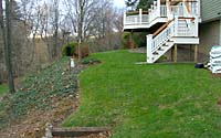 In addition to creating a small patio space, the rotting railroad tie steps at lower left also needed to be addressed.