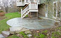 Note how the stone slab steps in the lower left hand corner of the photo are cut right into the bluestone patio.