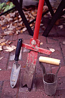 Narrow trowels and a steel planting bar are much more efficient than bulb planters when it comes to getting a lot of bulbs in the ground in a hurry.