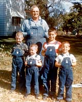I'm the skinny guy at far left next to my little brother Tim. Our grandfather stands proudly behind us and our cousins Scott and Roger on his northern Illinois farm in the mid-1960s.